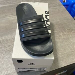 Adidas Adillete slides. Black. Brand new with tags. Size 7 men’s/8 women’s.